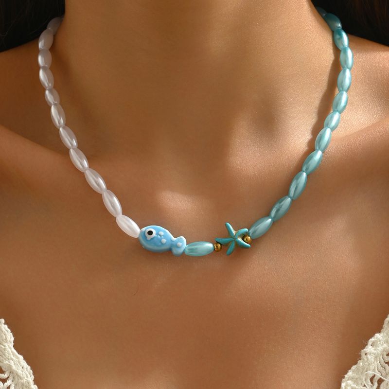 Blue and white beaded fish and starfish necklace